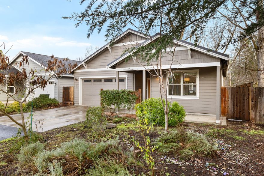 Exquisitely constructed custom Earth Advantage Platinum contemporary, single-level home in the heart of downtown Talent. This home boasts an open floor plan with a great room, vaulted ceilings, large windows, mountain and tree views, and abundant natural light. When you step inside, you immediately notice the upgraded hardwood floors and birch/alder wood cabinetry contrasted against the quartz countertops and a beautiful neutral palette. The long-lasting metal roof, large fenced yard, and mature landscaping make this a desirable property. The primary suite has a large walk-in closet and a tile roll-in shower. Built by Suncrest Homes, this quality home is just steps from coffee shops, galleries, dining, groceries, and the theater.