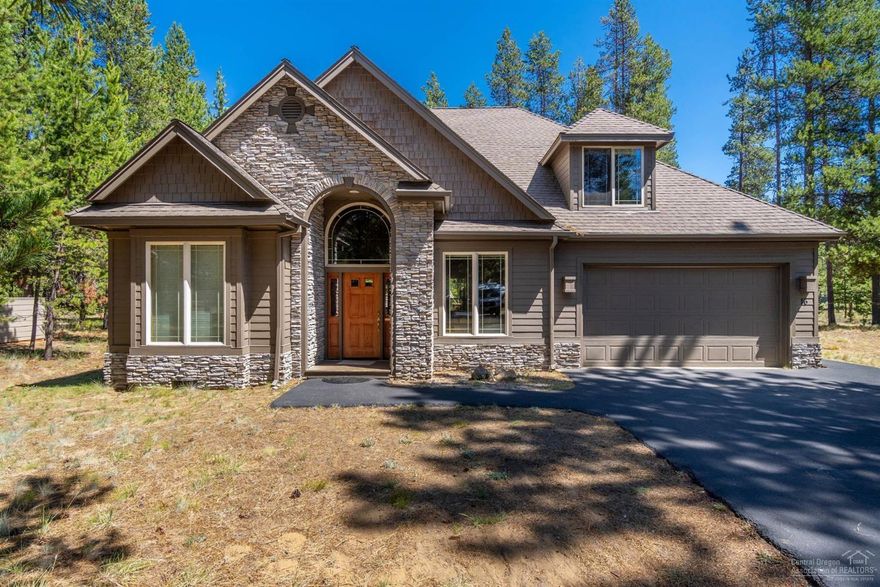 This NW style home in Fairway Crest Village offers a relaxing retreat for owners and renters alike. Natural wood accents and stone tiles throughout complement the contemporary features of the 5 BD, 3 BA home, including solid-surface granite countertops in the open kitchen, modern appliances, and a 2-story great room with large windows that look out onto an expansive deck. Enjoy cool evenings by the grand fireplace, featuring a stone surround that climbs to the ceiling, and natural-edge wood mantel. Spend summer dinners on the deck or warm your bones after a long day on the mountain in the large outdoor hot tub. Master on the main level features great separation, access to the back deck, a walk-in closet, and large bathroom with jetted tub. This home features an additional guest bedroom downstairs and 3 bedrooms upstairs, including a large bunk room, and 2 spacious guest bathrooms. This inviting vacation home has verifiable rental income and rental history. Make it yours today!