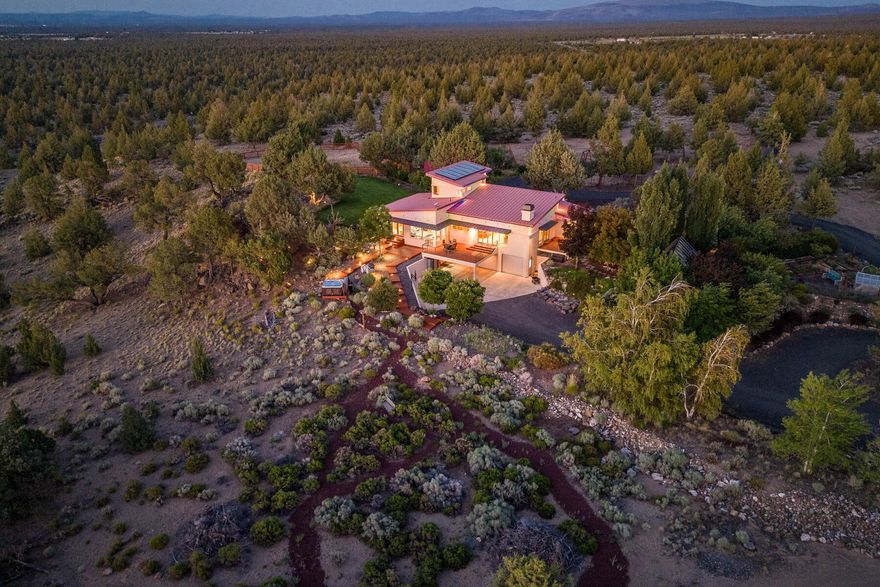 Discover a place where 39.47 unspoiled acres of natural beauty and exquisite craftsmanship meet in the most harmonious way offering tranquil country living with impressive amenities. A world of splendor awaits at this private, fully fenced hilltop oasis offering commanding panoramic views of the Cascade Mountain range—less than 15 minutes from downtown Bend. Thoughtfully crafted to maximize the setting, sunshine-streamed spaces offer expansive views throughout. The property includes a heated greenhouse, deer fenced garden and orchard, chicken coop, and corral. Store your recreational and hobby gear in the attached 3-car garage, workshop, and bonus room. Ride out to thousands of acres of BLM lands, incredible road cycling routes, and OHV trail systems just beyond your front door. Whether you are looking for a place to get away from it all, a multigenerational estate, equestrian property, or recreational opportunity, this property celebrates the Central Oregon lifestyle in a big way!