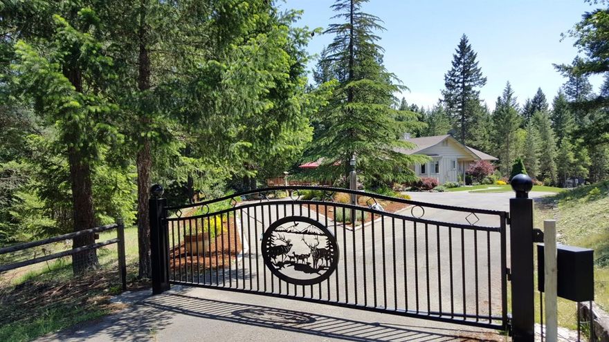 Welcome to Paradise and just 10 minutes from Grants Pass. Ashbrook Ln is a private street off of Cambridge. This nicely forested piece of property has something for all. Nice corner lot that is cross fenced and gated with two entrances for a total drive-thru experience. Seasonal creek, large over-sized, covered shop with RV doors, power and extra storage on side and behind. RV parking, boat parking, lots of parking and the house is surrounded by lush green lawns, beautiful landscaping with your treed setting. Enjoy the deck and beautiful views right off the living room and front door. Open living room with wood beams, energy efficient wood stove and heat pump. Large open kitchen with granite, lots of cupboard space and two ovens. Large master bedroom with bath. Landscaping all on drips and sprinklers and the forested property even has sprinklers throughout as well. Nice setup and you won't be disappointed. Call to see this private home today. Appointment only to view. All information d