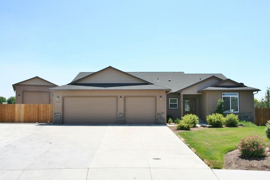 Super Sunset East Location! Outstanding 2233 SQFT Soyland home, open floor-plan, great room & den/4th bedroom living spaces, grand vaulted ceilings, gorgeous wood & tile floors & cozy gas fireplace too. Stunning kitchen w/ abundant custom cabinetry, massive granite island & breakfast bar, walk-in pantry & spacious dining room. Huge master bedroom/bathroom, separate shower & soaking tub, dual sinks, huge walk-in closet w/ organizers, recessed lighting & abundant crown moldings. East facing covered deck  w/ BBQ gas line & relaxing views of open fields & mountains. Amenities include central vac systems, gas oven/range HVAC with central A/C & gas heat. Approx 28x32 895 SQFT 3 car garage, 12 x16 203 SQFT heated shop, 15 x 26 405 SQFT heated RV garage Abundant paved RV parking area. Covered BBQ  area with circular patio perfect for summer entertaining too.  Hot tub & raised vegetable gardens, in-ground sprinklers, streetlights & walking distance to OC&E Bike Path make this home perfect.