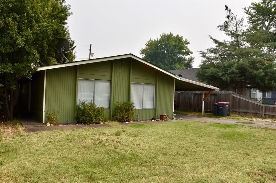 Large lawn,carport plus off street parking for front unit, lots of off street alley parking for back unit, newer roofs, Rents $1625. each units had storage shed.