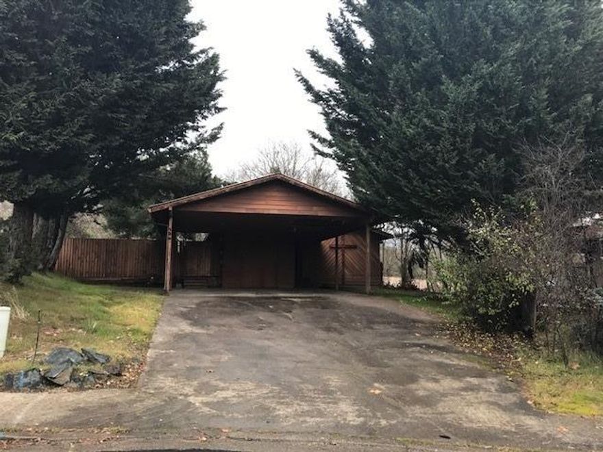 This home has major cosmetic repairs and will not qualify for a loan. Home sits at the end of a Cul De Sac on the edge of town. There is a new metal roof and forced air heater, but needs everything else. This Charming home needs someone to return it to its previous Glory.