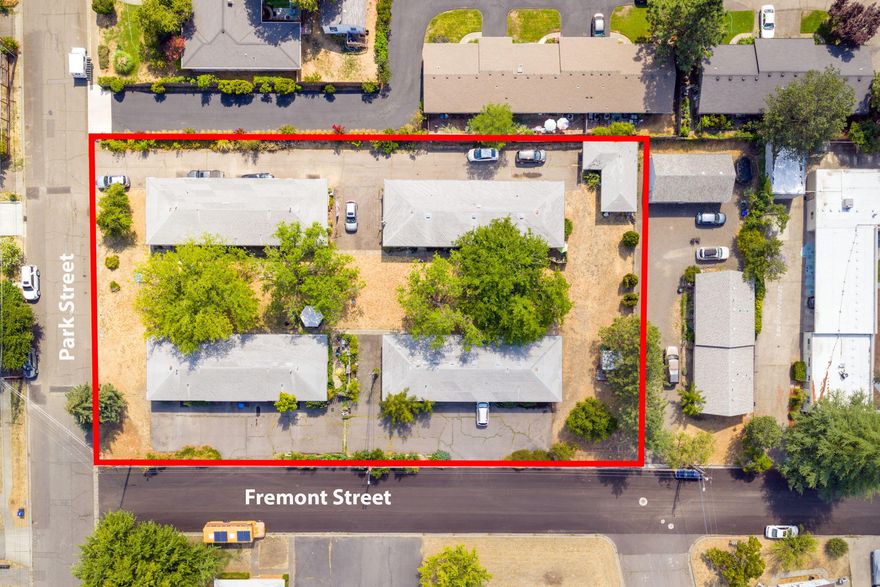 8-unit residential income property in Ashland on beautiful Park Street! Six 2 bed/1 bath units and two 3 bed/1 bath units. Lots of off-street parking. Each building has a 2 car-carport except the 3 bed/1 bath building there is a garage. Lovely open common area with trees and grass on this .93 of an acre property! All single level units. Units all have laundry rooms.  All information is deemed reliable but not guaranteed. Buyers are advised to conduct their own due diligence. Price reflects condition.