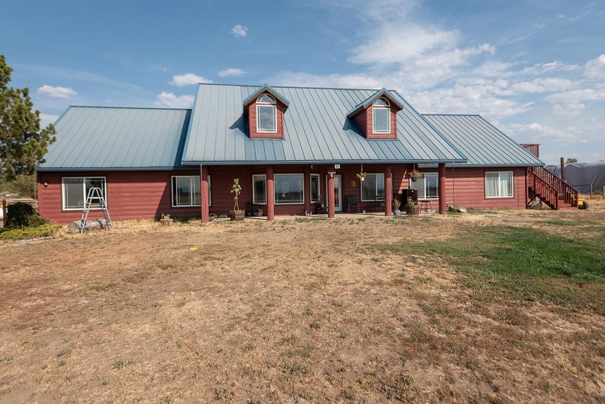 Located in the scenic landscape of Culver, this stunning property spans over 70 acres with 66 acres of  irrigated farmland, perfect for tranquility and productivity. At its center is a charming log home with rustic elegance, featuring rich wood accents and beautiful views of the surrounding fields and Cascade Mtns. 

In addition to the log home, several versatile outbuildings are available for various uses, including agricultural storage and workshops. The expansive acreage offers diverse agricultural opportunities, supported by an efficient irrigation system.  A dedicated laboratory setup enhances the property's unique offerings.

This exceptional property in Culver combines comfortable living, agricultural   potential, and scientific exploration, creating an inviting environment for families or entrepreneurs in a perfect blend of rural life and productivity.