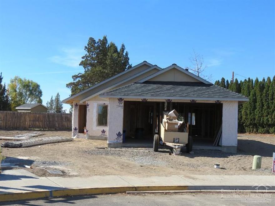 New NW Redmond home in Crane Meadows. 3 bedrooms, 2 baths with over 1500 SF. Very open floor plan with great room opening into the dining and kitchen area. Laminate flooring with carpet in bedrooms. Knotty Alder cabinets, Quartz countertops and tile backsplash in the kitchen. Great room with vaulted ceilings and lots of natural light. Master has corner soaking tub, separate shower, huge walk-in closet with an abundance of space. Front yard landscaping with sprinkler system and a double car garage.