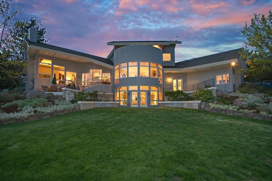 Architecturally designed, 1 owner, Stunning contemporary home on 5 acres with Unbelievable panoramic views! Dream property 12 minutes from Asante Medical, shopping, school, golf. Unique window layout also captures the VIEWS. Soaring ceilings, cozy fp in spacious LR & DR with lighted built-ins. Gourmet kitchen with custom cabinetry, finest appliances & layout all open to a solarium nook in which to enjoy your delicious creations. Guest suite & large laundry for sewing & craft work complete the first floor. Enjoy a master suite on top of the world with its sumptuous bath & hot tub balcony in the sky! Middle floor features 2-3 more large bedrooms, bath and office. Lower level has the tv game room w/pool table, half bath & amazing storage areas. Home is loaded with built-ins. Also,enjoy a Gorgeous pool with outdoor entertaining area, an observatory and oversized 3 car garage. Everything is pristine & this package exudes beauty, warmth & the feeling that you never want to leave Eutopia!