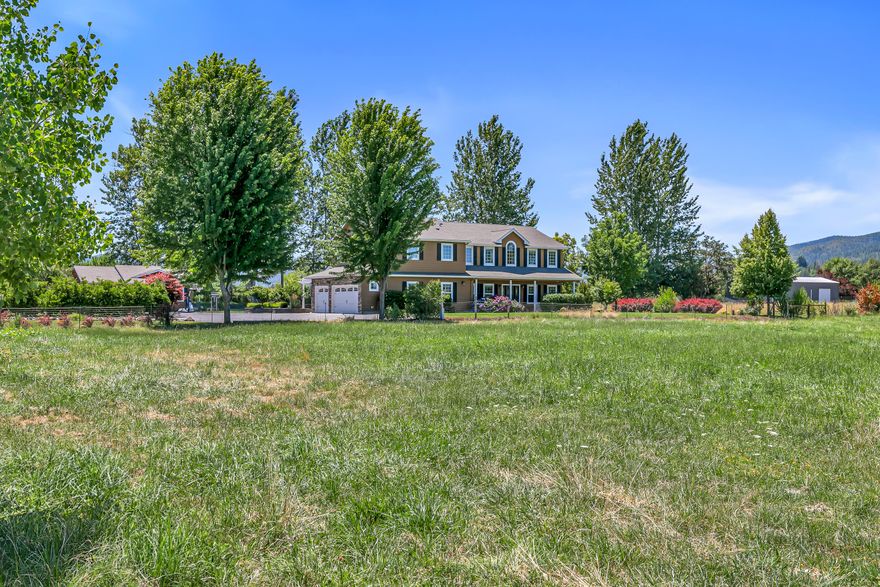 Discover a property designed for the way you want to live—where comfort, space, and serenity come together to create an exceptional lifestyle. Enter inside to a thoughtfully re-imagined main level featuring an open-concept kitchen and family room with warm stained alder cabinetry, rich granite countertops, and wood-look tile flooring for lasting durability. A custom gas fireplace adds a cozy focal point, while large windows flood the space with natural light and frame peaceful views. The home offers six bedrooms plus a dedicated office, providing plenty of space to live, work, and relax. The primary en-suite has just been tastefully refreshed with newly painted cabinetry, new countertops, sleek shower doors, and more. Outdoors, enjoy irrigated park-like grounds. A detached shop offers generous space for hobbies and storage, while a 30x60 metal building adds even more room.