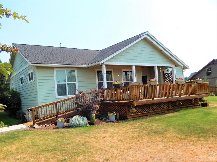 Wonderful home with Cascade Views! One bedroom in this 4 bedroom/2 bath home has french doors and could easily be flex space. Home features bamboo, tile and laminate flooring. Tiled counter tops, knotty alder doors, moldings and cabinets. Exterior has an insulated chicken coop/storage shed, is fenced and has lilacs and raspberries. A bonus garage along with the double attached garage has drive through capabilities.