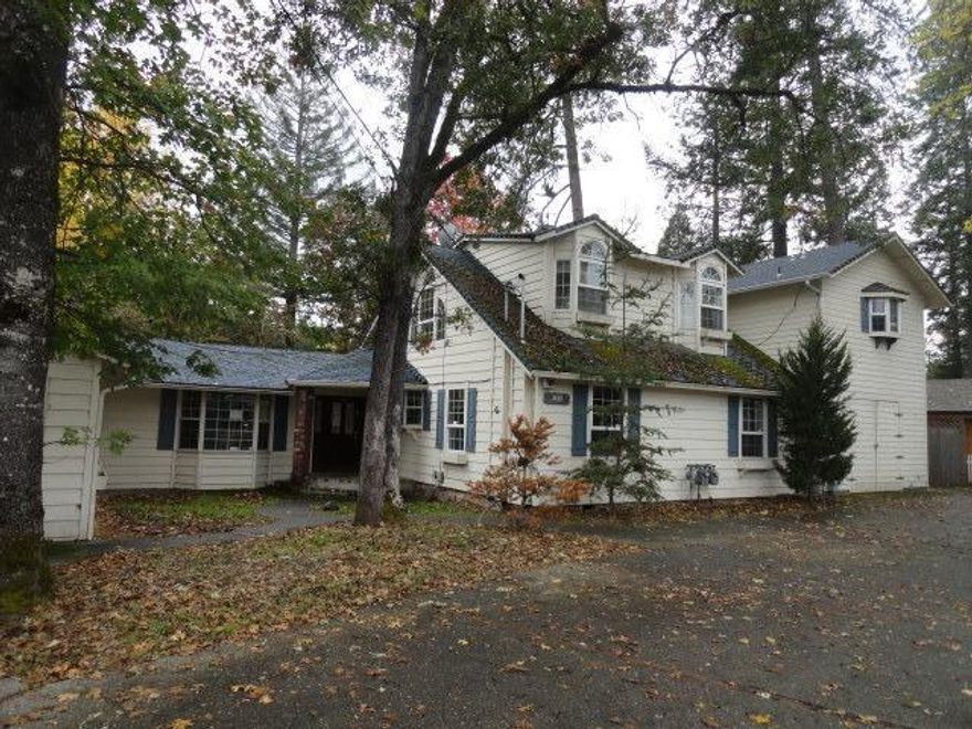 Remodeled older home to beautiful design. Formally designed for a bed & breakfast. Long slope to the Rogue River. Each bedroom has a gas fireplace. Bank owned property, sold as is.