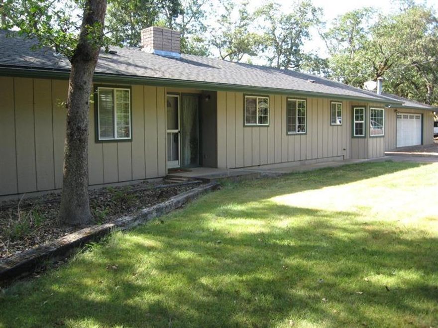 For watching sunsets the western views from the wall of windows in the living area is fantastic. This well maintained home with the numerous tall shade trees is a single level ranch style. It was originally built in the early 1960's & still has that charming feel. More windows in a large guest bedroom make the room bright & light. A soaking tub & separate shower in guest bath is a nice addition. The newer master bedroom has a window seat & large walk-in closet. There is tons of storage. The large inside laundry is right off the kitchen. The large patio has a view of Upper Table Rock. There is an oil monitor in the living area that makes heating the home more efficient & less expensive. The seller installed a new water purification system. The heated garage/shop has many purposes. The exterior was professionally painted. The roof is probably less than 10 years old. The 1.5 acre level property is all fenced & gated. There is full sprinkler coverage irrigation in both pastures.
