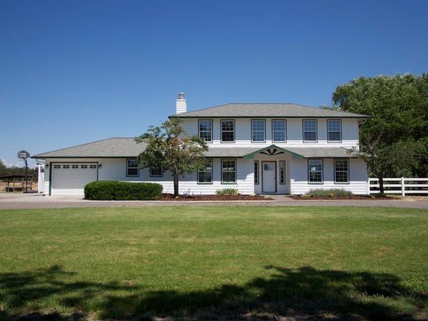 Southern Oregon acreage! Just outside of Central Point is a beautiful level 5.85 acre parcel. The property is fenced and cross fenced. A generous floor plan with over 2500 S.f. with 4 bedrooms and 3 full bathrooms, one bedroom on the first floor can be used as an office. Large bay windows allow views of the back pasture and open space beyond across the valley to Mt McLoughlin. Large living room, spacious dining and family room. Circular driveway with shade trees that takes you up to the front door with ample parking for vehicles. RV parking with hook ups and for that extra bonus a 1200 square foot shop.