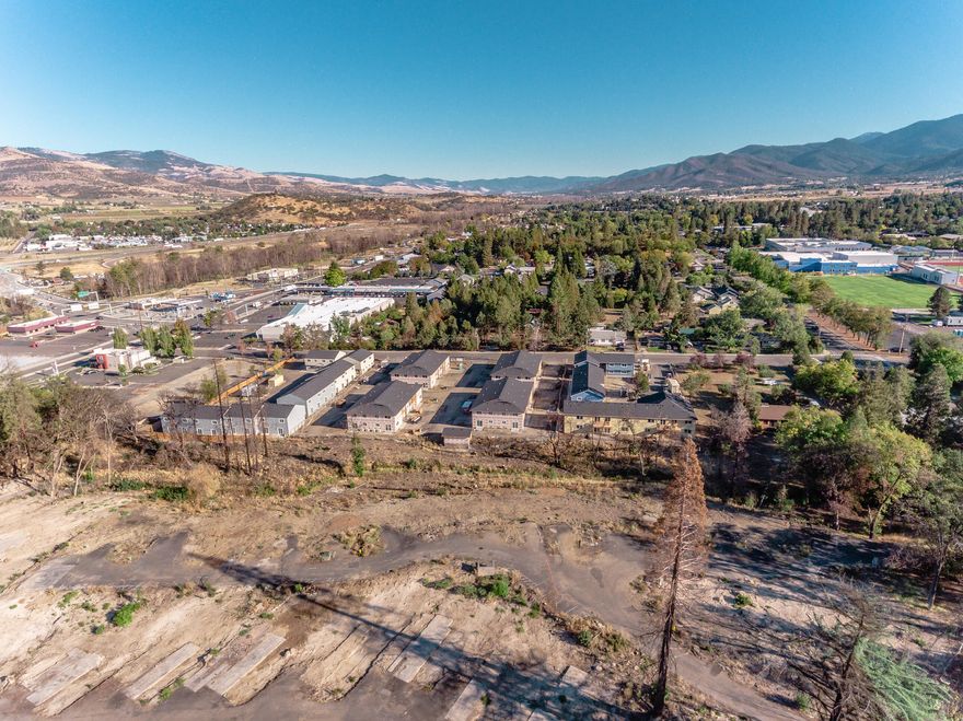 Developer's delight!!  What was once a peaceful & thriving townhome community along Coleman Creek was impacted by the Almeda fires, and is now FEMA-cleaned and ready for rebuilding.  There are 18 residential .02-acre taxlots which once hosted 18 1400+ sq. ft. 3-bedroom, 2.5 bath 2-story townhomes, outfitted with garages & decks, with community space surrounding.  Coleman Creek runs along one border, where back decks once overlooked.  Detailed current plans for townhome community rebuild can be included in the sale.  Driveways and Utilities are in place for rebuild, and Seller's Development Credits will stay with the land & be credited for a redevelopment that uses the exact footprints of former development.  Develop all at once, or build & sell in quads at a slower pace.   Fantastic location, tucked off of Hwy 66 & near all conveniences.  Buyer due diligence regarding all aspects of property and property use.
