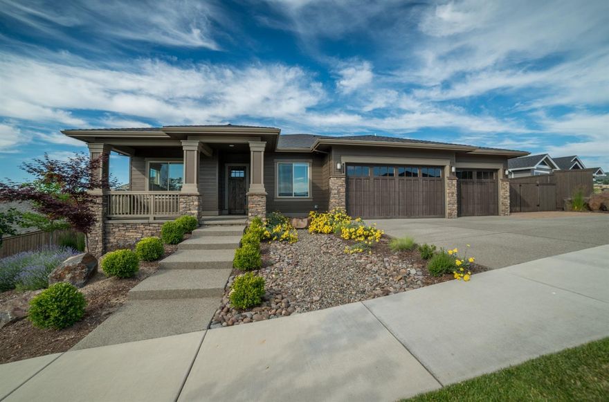 One of the best Pahlisch homes built w/amazing floor plan all on one level. Northwest recognized award winning builders. Located in the heart of the Bella Vista Heights community w/panoramic views of city lights & Mts. Lg great rm w/floor to ceiling stone gas log fireplace, built in cabinets, hardwood floors throughout & designer carpet in bedrooms & office. 3 bdrm, 3 baths w/ upgraded tile floors & showers. Vaulted & coffered ceilings. Lg kitchen w/ dbl convc. Oven, gas cook top, granite counters w/ lg island & walk in pantry. Buffet bar in formal dining rm & breakfast rm w/ built in wine refrige & wine rack. 8' high solid wood doors, custom trim & moldings. Huge covered deck overlooking your backyard w/ nice landscaping & level lawn area! Spa like master suite w/ tile walk in shower, soaking tub, dbl sinks, water closet, tile floors & walk in closet w/ built ins. Slider off master to covered deck, 3 car finished garage w/ on demand gas water heater. This is a beautiful home!