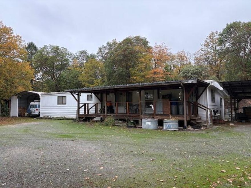 This property is a great value at this price! Beautiful, improved 2.61 acres up on a knoll with lots of room and plenty of parking or room for a shop. There is an existing RV Cover and many outbuildings that could be used for either storage or hobbies or whatever the imagination comes up with. Lots of opportunities here, and a tremendous amount of potential. Priced very competitively.