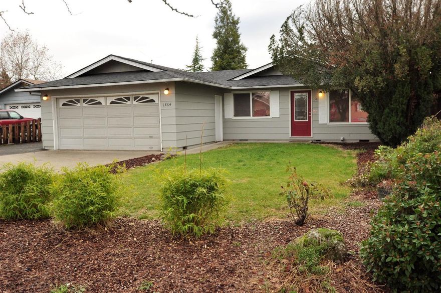 This beautiful 3 bedrooms 2 bath home is completely remodeled inside! The cozy 1406 sq. ft., home is nestled in dead end street in a low traffic area of East Medford on a .24 acre lot. New high quality granite counters with large new sink adorn the kitchen, granite breakfast bar extends into a separate family room. The home has brand new quality carpet, paint, water heater, all lighting fixtures, and high quality wood laminate. The master bedroom is spacious and features a sliding door to the back patio. The separate family room off of the kitchen features a gas fireplace and access to the backyard. The enormous backyard is fenced in with a covered patio, raised flower bed and an insulated workshop with power. Nicely landscaped with mature trees, RV parking and numerous updates make this a must see home! This property will not last long!