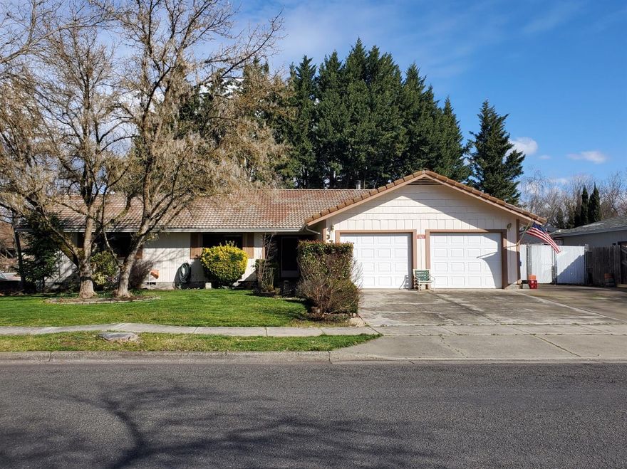 Come see this well kept single level home on a large lot in this great neighborhood. The living room and the master bedrooms have lovely vaulted wood ceilings. The kitchen is light and bright with a breakfast bar and plenty of cabinet and counter space. There is plenty of parking room in the large 2 car garage and parking lot, plus additional paved area for an RV or other toys. The fenced back yard has a large deck for BBQs and entertaining, and room for a garden.