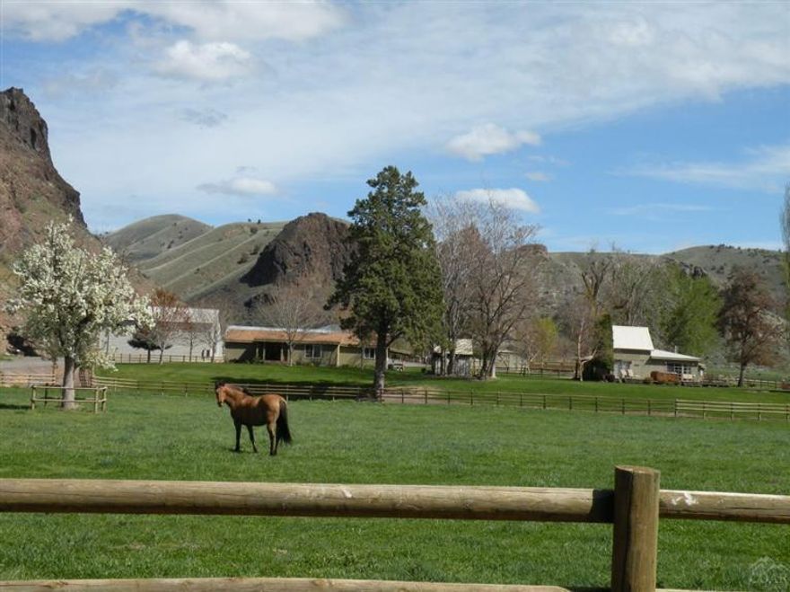 End of road privacy, spectacular beauty, hunting, fishing, cattle. GM Ranch, on the wild and scenic John Day River, controls access to nearly 40,000 acres. Cattle share thousands of acres with elk, deer, antelope and game birds while the river supports Bass, Steelhead, trout & waterfowl and supplies irrigation water to 200 acres of pasture/hay ground. The scenic beauty of the ranch's terrain and its plant and animal occupants is an artist/photographer's dream. A truly special place.