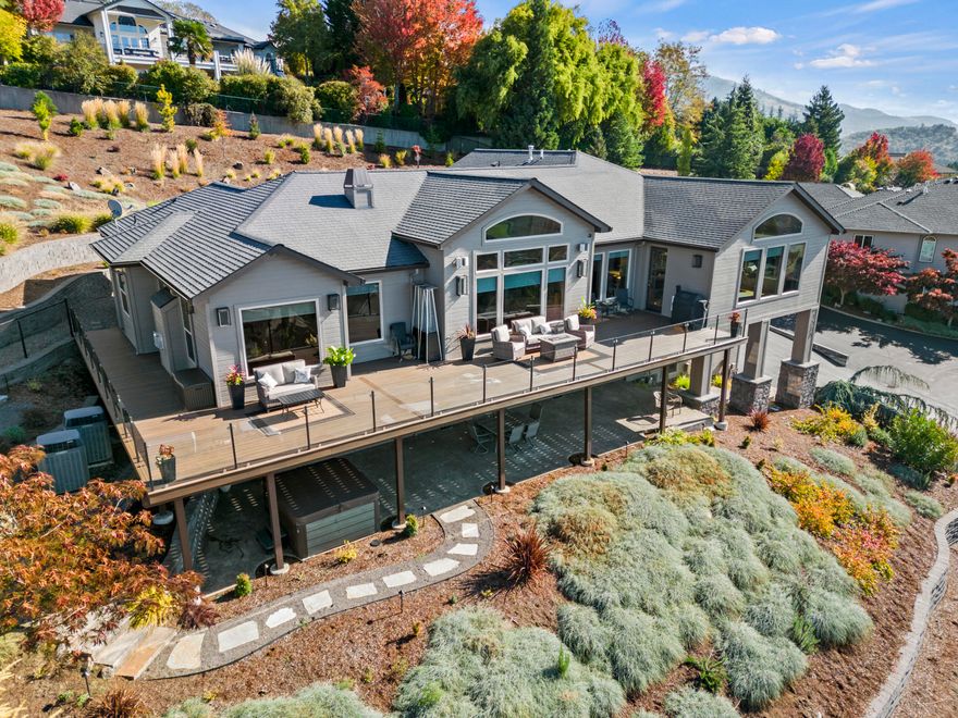 Top of the world views!!!  Welcome to your dream home! This modern, expansive property offers stunning views of the valley, mountains and everything in between, as well as a spacious and elegant living space. You will love the 4 bedrooms, 4 bathrooms and the updated gourmet kitchen complete with upgraded appliances where you can cook and entertain with style. The open floor plan, high ceilings and large windows create a bright and airy atmosphere, while the hardwood floors, fireplaces and custom finishes add warmth and charm. Enjoy the extensive views from throughout the house, the huge deck or even the hot tub below.  This home also has potential for in-law quarters.  Don't miss out on this rare gem!