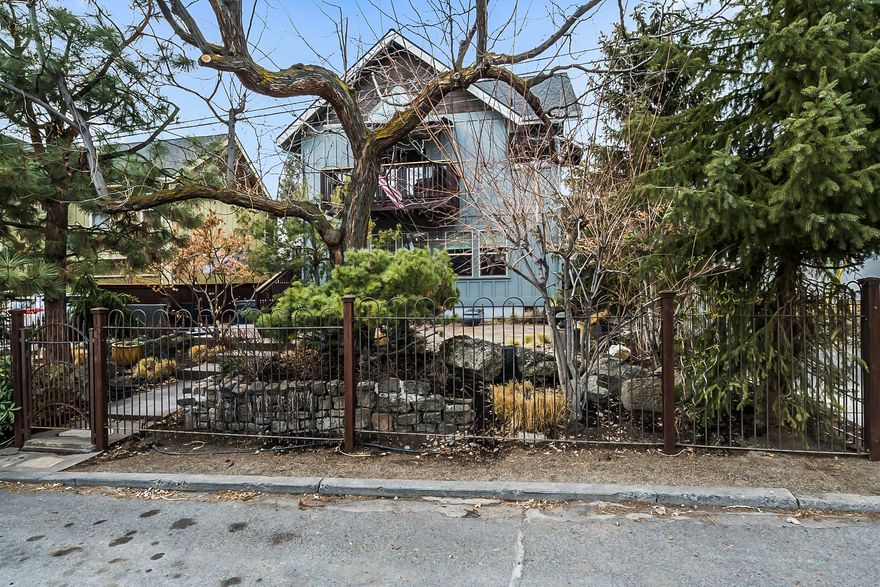 Great location 1 block from Newport Market in NW Bend. Many possibilities. Unique RM zoned property. 644 sq ft lower level could be in-law unit, home business or bonus room. 1225 sq ft upper level, 2BR 2BA w/private access or optional inside access/ Bamboo floors & granite counters in both. Upper level features vaulted ceilings, exposed beams, professional stainless appliances, wrap-around bar, maple cabinets & deck off the kitchen. Fenced & landscaped w/water feature & sprinkler system. 2 car attached garage with alley access. Blocks from shopping, restaurants, parks, schools & downtown. Buyer's due diligence required regarding uses allowed in RM zone.