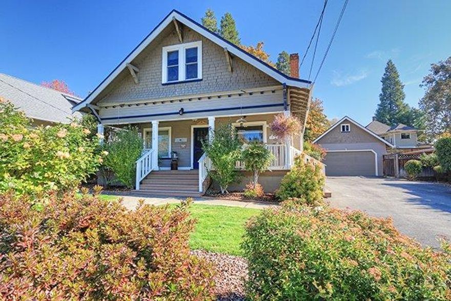 This Stately Lady, built in 1904, exudes charm and elegance in a sought-after neighborhood in NW Grants Pass. Lovingly preserved and meticulously maintained, she boasts 1959 sq/ft with three bedrooms and 2 baths plus a spacious home office/den. Classic craftsman features abound in the column work and extensive use of crown molding. The kitchen has been beautifully updated with a farmhouse sink, new cabinets and drawers with the soft-close feature, granite counters, and laminate wood floors. The original downstairs parlor'' is now a large home office, but could easily be converted to a 4th bedroom. Upstairs, there are two more bedrooms, a bath and the coolest reading nook. French doors lead from the rear of the home to the back deck, the perfect outdoor man cave'' with a television slyly tucked away on the wall of the garage. There's just the spot for an outdoor kitchen tucked around the corner. The grounds are manicured and everything is on an irrigation system for low maintenance.
