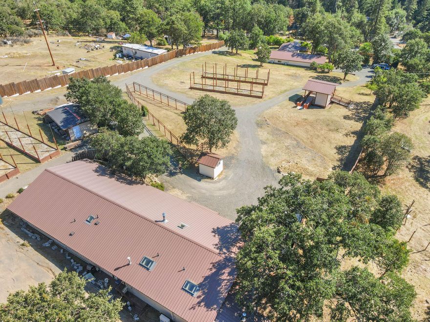 Unique Multi Generational Jacksonville Opportunity! 2 Homes on Separate Parcels!
Just 7 minutes from historic downtown Jacksonville, the Britt Festival, dining, shopping, and trails, this property features two refreshed homes with separate addresses—perfect for multi-family living, guests, or rental income. The upper home is a 2-bedroom, 2-bath straw bale home with an open floor plan and bonus family room. The lower home is a 3-bedroom, 3-bath home, with two bedrooms featuring ensuite bathrooms with luxury walk-in showers, a wet bar and could be ideal for short-term rentals or guests. Combined, the homes offer 5 bedrooms and 5 full bathrooms. Outdoors, enjoy raised garden beds, a gazebo, and a peaceful valley setting.