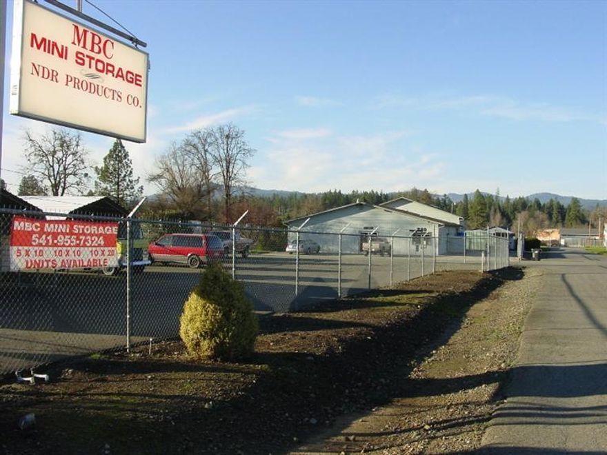 Great Multi-use Facility on 3 separate tax lots totaling 1.29 acres. Lot 1 has a 5450 S/F Industrial Bldg. with Manufacturing/warehouse office space. Lot 2 has 68 self storage units and approvals to add 18 more. Lot 3 has 3 metal canopy carports with 5x10 storage units. This is a 50x100 lot that has the best visibility from the road and could be developed further. The current owner had a manufacturing business and built the self storage units for cash flow because they require very little management. The owner had a sheet metal/machine shop and all his equipment is still set up in the bldg and could be purchased with the building. He would also just sell the equipment if someone was interested, if not he will have it removed prior to close of escrow. Either as a user or an investor this property has a lot to offer. And if all that isn't enough the owner would prefer to do an owner carry with a minimum of $150,000 down.