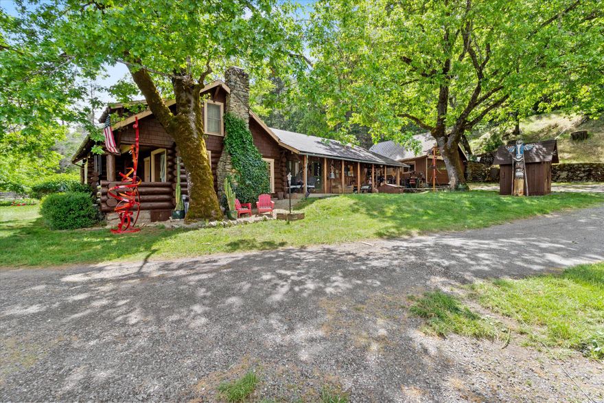 Beautiful Applegate 18.1 acre property of renowned sculpture artist offers quiet country living nestled in the heart of Applegate wine country while only 20 minutes to town. Shopping and food are 5 minutes away. Multiple Family setup or homestead. One of a kind classic log home split into 2 different living spaces, one being 2 bed/1 bath, the other being 1 bed/1 bath, easily converts back to a single-family home with a 3 bed/2 bath setup. Property has irrigation rights and 3 wells, the well being used gives great production. It has 5500 gallons of water storage for fire protection. It features chicken coops, 5 horse stalls, fenced organic garden, and a large green house. One of the best options of the property is the buildable house pad with a newer insulated 40/24 shop on a concrete slab, big enough for large RV parking. Property has a backup generator. This property offers so many options for a self-sustainable lifestyle. A must-see home. Buyers to do own due diligence for permits