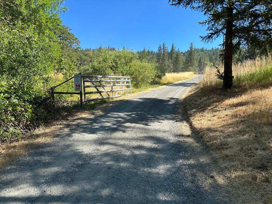 This buildable 5 acre parcel had a manufactured home that has since been removed. All 5 acres is zoned EFU land and is split by Humbug Creek Road. It contains both open pasture and wooded area with primarily mild to moderate slopes. The entire lot is Deer and Elk wither range and is crossed by 3 tributaries of Humbug Creek. Prime Location: 10 minutes from Red Lily Winery and 15 minutes from Applegate Lake, perfect for wine enthusiasts and outdoor activities.