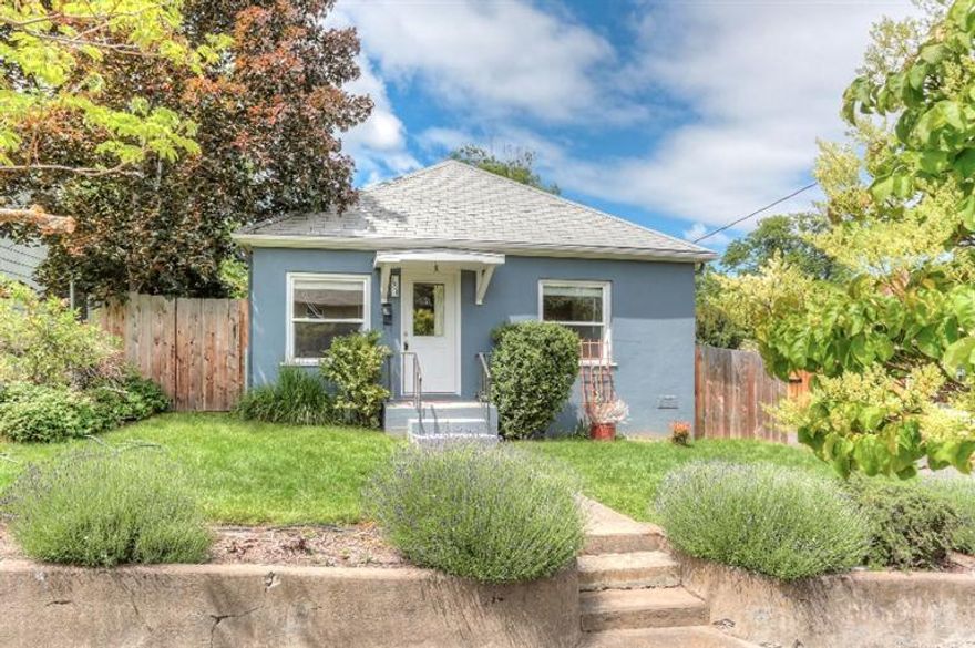 Wonderful 1940's cottage and new detached additional living space that offer lots of flexibility as guest space, office, art space and​,​ with the R-2 zoning, lots more. Main home is a cute 805 sqft, 2 bedroom and one bath with fir floors, natural light​ and was remodeled in 2000 with new kitchen, new double paned windows, skylights and a cozy natural gas fireplace. The detached living space is 400 sqft and was renovated by Conscious Construction in 2011 and has a great feel with stained cement floors, beautiful natural stained wood trim, concrete counter tops, mini-fridge and cabinets with stainless steel, built-in book shelves and custom finishes using reclaimed and restored wood plus a skylight. There is a private, fenced backyard for your garden too! All this and the home is centrally located just blocks from downtown Ashland, library, shopping, SOU and in a desirable, well established neighborhood.