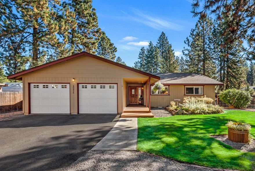 Discover this charming single-level home featuring three bedrooms and two bathrooms while being nestled amongst the pines on over a half-acre in the Homestead neighborhood. The private yard features ample serenity with a deck and hot tub, manicured lawn, and a smattering of fruit trees. The thoughtful floorplan offers ample living space with both a living room and family room. The oversized laundry is located just off the garage and the kitchen has been tastfully updated. Enjoy the perfect blend of nature and convenience in a peaceful, yet accessible location.