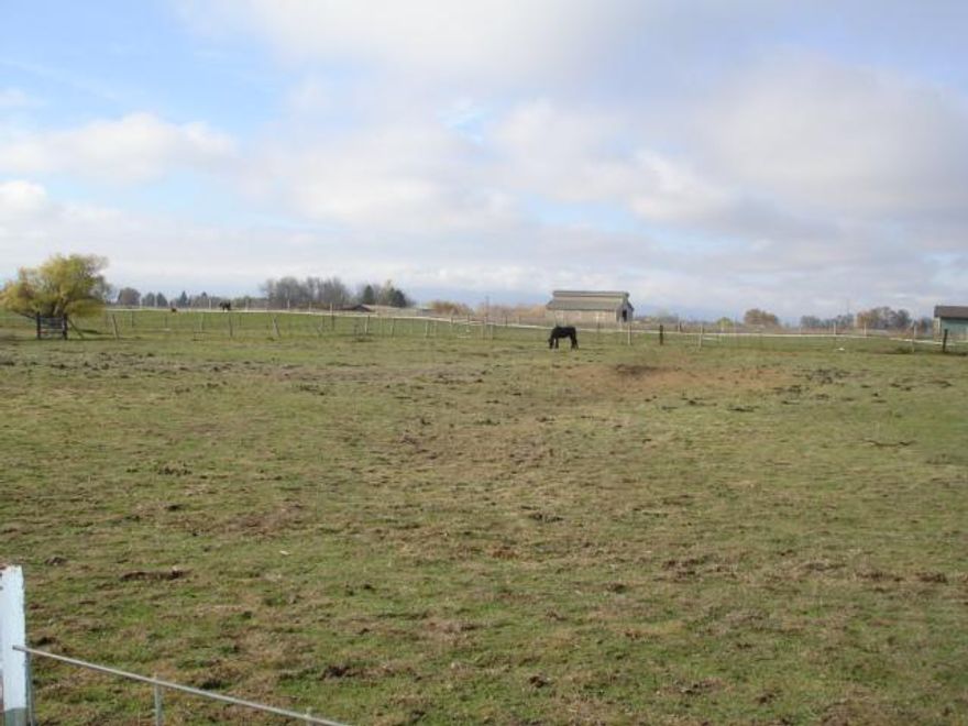 Horse property!!! Great 9.86 acres with 2 barns, a large 9 stall barn & a smaller 4 stall barn, a carriage shed plus several small sheds for storage. Fenced & cross-fenced. A great well per owner approx. 30 GPM. Value is in the land. Home is a 1975 single wide mobile & needs lots of TLC. You can tweak it how you like. Property is being sold as is.