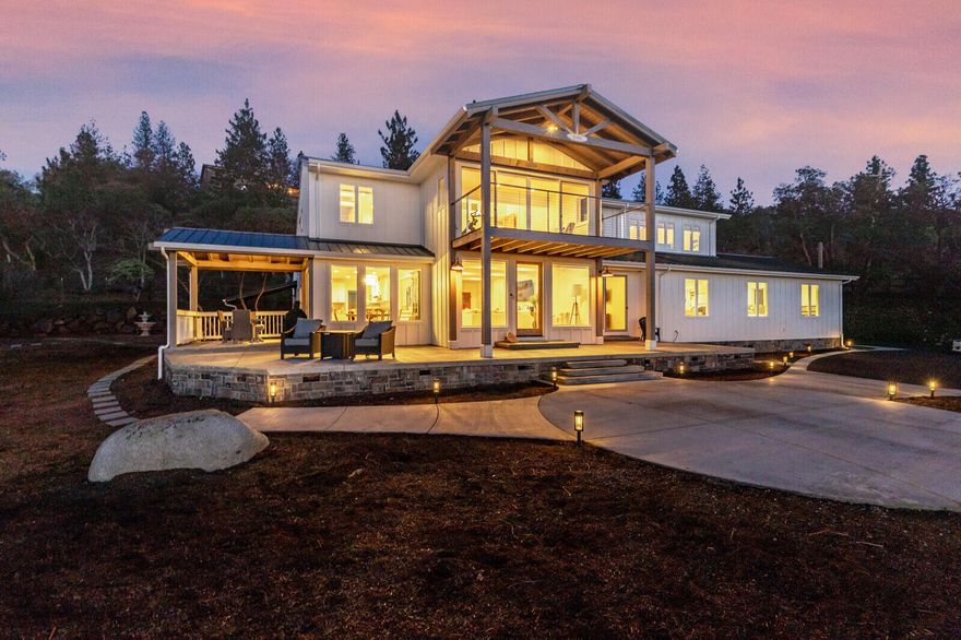 Fabulous Modern Farmhouse on 2.87 acres in desirable Sun Ridge Estates.  Endless views of surrounding mountains, stunning sunsets and city lights.  This amazing home features 3656 sf of  luxurious living space, an 1100 sf attached shop with half bath plus a 2 car garage.  The main level features an open beam ceiling with expansive windows and an abundance of natural light, a newly remodeled kitchen with white shaker cabinetry, quartz countertops & stainless appliances.  The main level also includes a spacious bedroom with a fabulous full bath plus large guest quarters with private entrance.  The upper level features a  master suite with  amazing views from the floor to ceiling windows plus a patio to enjoy gorgeous sunsets, a spa bath with walk in closet and plenty of built-in-storage. an office separates the master suite from the spacious additional bedroom with vaulted beam ceiling.  There is a roof top sun deck,  detached yoga studio, paved and gated drive and so much more...