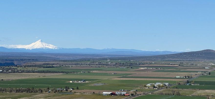 Craft your ideal home amidst breathtaking views of the Cascade Mountain Range and the picturesque Culver farm valley. Nestled on an excavated building site. This parcel boasts a new septic and drain field system, providing the perfect canvas for your dream abode. Embrace the serenity, privacy, and panoramic beauty of the surrounds while designing your personalized retreat in the idyllic setting. OWNER WILL CARRY!!