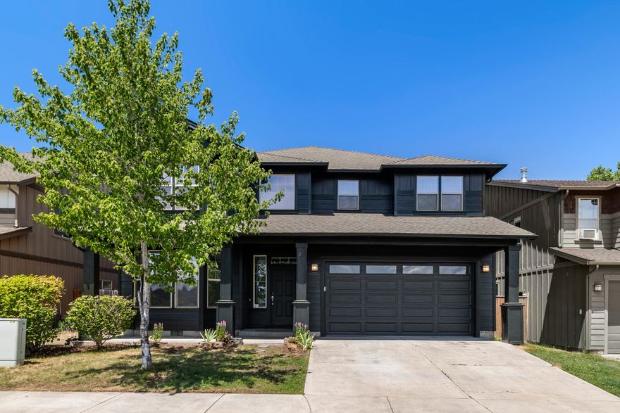 Welcome to this spacious and beautifully updated home, filled with natural light and designed for comfortable living. The main floor features a versatile fifth bedroom or home office, along with a convenient half bath—perfect for guests or remote work. The large, open-concept living area flows seamlessly into the kitchen, where you'll find a center island ideal for gatherings, meal prep, or casual dining. Upstairs, you'll discover four generously sized bedrooms and a bonus room, offering plenty of space for family, guests, or recreation. Fresh interior and exterior paint, brand-new carpet, and a new garage door add to the home's move-in-ready appeal. With its bright, airy layout and thoughtful updates throughout, this home is ready to welcome you! Now offering a 1% lender paid credit at closing w/Matt Vogel at Guild Mortgage!