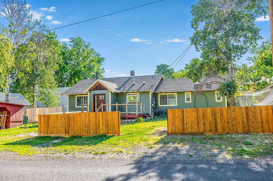 Experience the charm of Klamath Falls in this 3 bedroom, 2 bath home, on a generous .38 acre lot with plenty of outdoor space to enjoy. Inside you will find a bright and welcoming layout including a newer AC unit, garden window in the kitchen, and solar tube lights. The cozy living spaces are warmed by efficient gas heat as well as a certified wood stove. The Primary Bedroom has vaulted ceilings and skylights that brighten the room. Step outside to your fully fenced backyard, a 12x16 gazebo ideal for entertaining, room to add a garden with irrigation, includes a workshop shed with electricity, storage shed, a wood storage enclosure, as well as a 20x24 carport. You will find mature plum and crab apple trees adding seasonal fruit to your landscape. This home offers charm, functionality, and room to grow. Don't miss your chance to make it yours! Some personal items have been digitally removed from some photos.