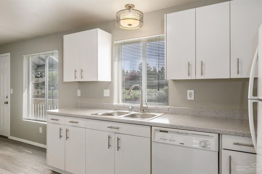 How many times do you get to purchase a condo that is practically brand new? Not to mention adorable. Close to the hospital this home is move- in ready and full of upgrades. Flooring, paint, vanities, lighting, countertops, sinks and faucets to name a few. New roof last year and new exterior paint is slated for this summer. You don't have to do a thing except enjoy Bend and all that is has to offer. Low maintenance and move-in ready. Welcome home. HOA includes water.