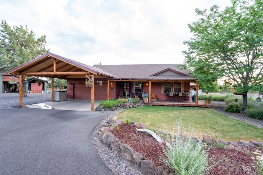 Very private horse property in a quiet area of CRR. This 3 bed 2 bath home has been updated with granite counter tops and Western appointments. Pac hardwood floors in the main bedroom. Remodeled master and guest bath with heated jacuzzi tub and custom shower. Laminate flooring in the living room and kitchen. Heat pump and A.C, outdoor kitchen. Custom water features, garden area. Lodge style back patio covers lodge style covered front porch and porte cochere, 3 pastures, completely fenced, cross fenced and gated for horses. 250'x150' Sand arena, as well as a 50' round pen, on 5.53 acre lot. Large Barn/Tack room Hay Storage, Horse Pastures. Fenced Back yard, amazing landscaping, sprinkler system. 2 car garage covered truck port. Huge filtered Swimming pond with waterfall. Newly painted inside and out, Greenhouse building, She shed, gym, RV hookup, paved driveway, solar entry gate amazing Cascade view of 9 peaks, Ride your horse or hike from the driveway for hours.