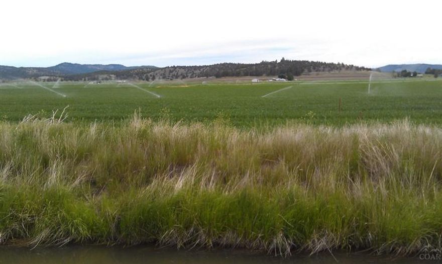 16.61 acres of high yield farm ground, irrigated, located north of Prineville. Irrigation equipment included. Mountain views. Seller to retain 2014 crops. Please see MLS 201400518 as part of this transaction.