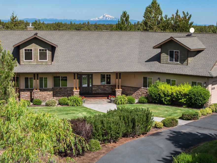 Enjoy peace, privacy, and stunning Jefferson views from this 20-acre wooded estate. The single-level home with an upstairs bonus room features a spacious great room with a raised hearth fireplace, white oak floors, and walls of windows overlooking the park-like backyard. The gourmet kitchen offers granite counters, a hammered copper farm sink, stainless steel appliances, an eating bar, and a large butler's pantry. The luxurious primary suite includes patio access, dual vanities, a porcelain soaking tub, tiled shower, heated towel bar, travertine floors, and a generous walk-in closet. A private guest suite w/outside entrance is also on the main level. Ideal for entertaining, the expansive back patio offers unmatched seclusion. Additional amenities include a large laundry room with ample storage, a 36x15 RV garage with 12'3'' roll-up door, a storage shed, and a 3-car extra deep attached garage.