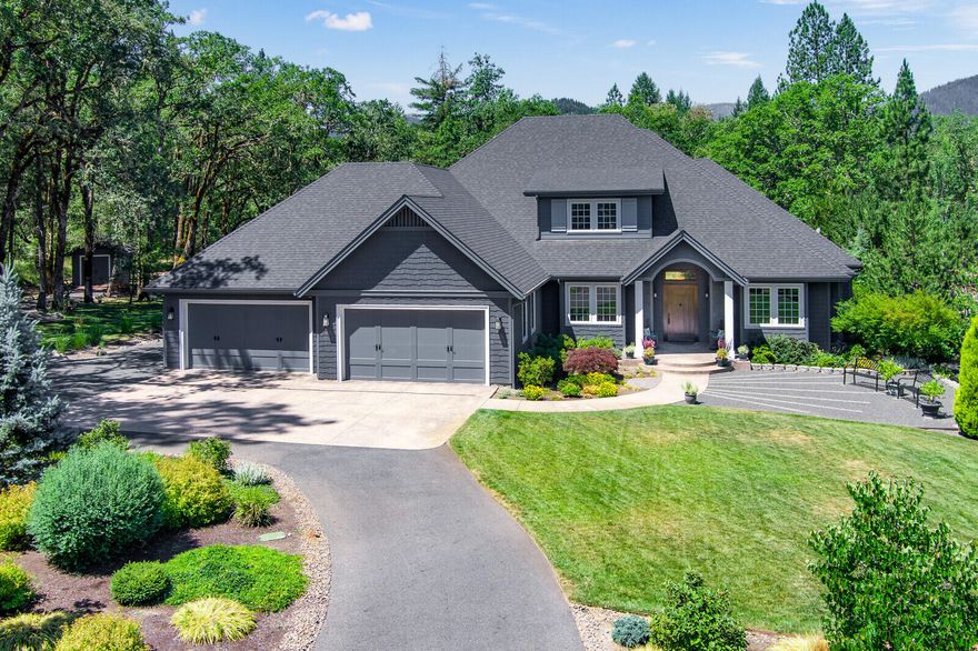 Exquisite custom home built by Dale Woodruff; finished in 2016.  Featuring  3 bedroom, 3  baths with 3816 sf.  The cook will love the kitchen with 8' granite island with storage, farmhouse sink,  induction cook top, commercial hood, pot filler, butlers pantry with cherry cabinetry, 2  wine refrigerators. Counter-depth refrigerator included.  Light and bright dining room with barrel ceiling, energy-efficient  blinds and hand scraped oak floor. Gorgeous en-suite  primary bedroom, cherry custom walk-in closet, soaking tub, tile shower, dual sinks and heated tile floor. Great room has Sapele wood built-in entertainment center and  surround sound.  Large family/hobby room with built-in desk and bookshelves; custom barn door.  Laundry room with dog bath, built-in linen; washer/dryer included.  Attached  1133 sf garage; garden shed.  Two Geothermal heat pumps and beautiful landscaping with native  oaks on 2.89 acres.  Covered patio is perfect for entertaining.  Stunning craftmanship.