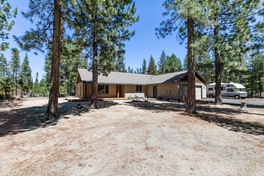 Tranquility Awaits You Just 7 Miles South of La Pine. Offering privacy yet convenience. Northwest Ranch Style Home...Freshly stained wood deck, Log accents & Inset lighting illuminates your path to the front door. Log accent entry, vaulted open floor plan Great Room, Kitchen & Dining w/skylights. Great room has wood stove & slider to side deck. Spacious Dining room complemented by a set of French-doors to back deck. Eat at island bar, SS appliances, dishwasher, microwave, refrigerator & propane/gas Range/Oven. Master suite able to accommodate good sized furniture. Walk-in closet, jetted soaking tub, step in shower & dual vanity. Guest beds & bath down the hall. Laundry room leads to a 528 SF finished garage. All this situated on a corner lot. Plenty of room to build a shop. Great neighborhood, School Bus Stop right out front & very low taxes. Central Oregon is a Great Place to Live & Play including World Renowned Hunting & Fishing. Make this your Get-Away or Forever Home.