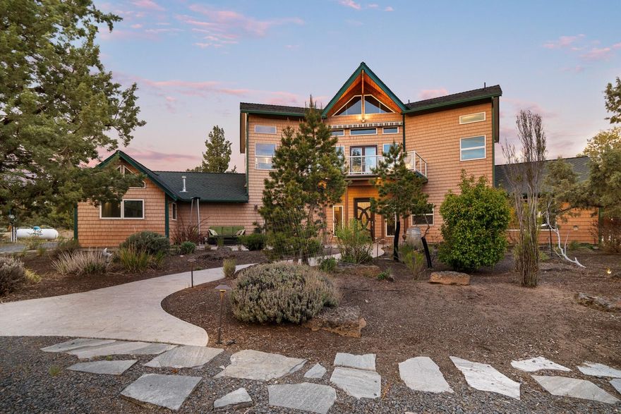 Set against the picturesque backdrop of Bend, this one-of-a-kind home offers a blend of seclusion, versatility and easy access to outdoor activities. The main floor is designed for ease of living with ADA accessibility and a spacious room on the first level which can be effortlessly transformed into a primary suite with double walk-in closets. On the other wing of the main level, enjoy a recently updated indoor saltwater pool, sauna and hot tub. Recent updates include fresh paint, new carpeting, cross-fencing, an elevator lift, new mini-splits and more (see the attached upgrades list). Spanning nearly ten, low-maintenance acres, the property includes several RV hookups and a detached structure complete with a kitchenette, w/d, outdoor patios and its own driveway - an ideal guest house or home office. Just minutes from downtown Bend and close to mountains, trails, river, and outdoor recreation, this high desert sanctuary offers a unique combination of convenience and tranquility.