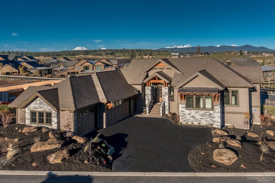 Newly completed stunning custom home located on a view lot in Cascade Vista at Tetherow. Crafted by Ollin Construction, this home has been thoughtfully designed for livability. Dominant features include primarily single-level living with an enormous rear deck; an add'l bedroom, bath & bonus room in the lower level; vaulted ceilings & large windows framing the Cascade Mtn views; a designer-picked transitional interior style and a timeless northwest exterior. Home is Earth Advantage certified. EPS score: 111.