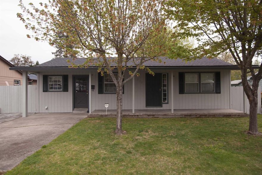 Enjoy this large property and home with more than 2100 sq. feet in town with a new paint job, new roof, and recently remodeled inside. The kitchen offers all the matching appliances including, duel fuel oven/range dishwasher, and ample granite counter tops and storage for any chef. The large backyard has a deck for barbecuing, raised bed gardens and in ground sprinklers. There is also access to irrigation (pump included) making it easy to water your new yard. The shop in the back has room for your hobbies and includes a bonus room that has been used for an office. The incredible bonus is there is plenty of room to park all your RV's, boats and quads. This home will go fast! Make sure you see it ASAP!