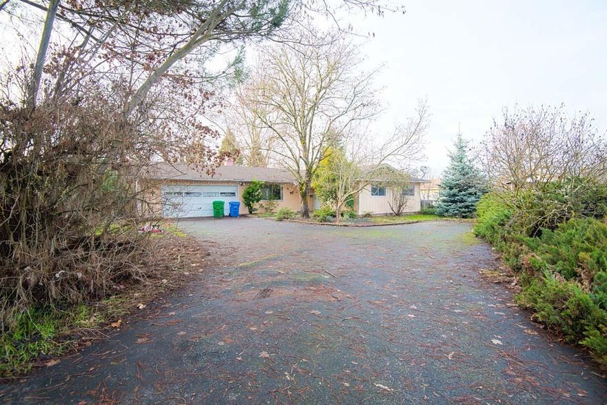 Large lot located in a culdesac just outside downtown Grants Pass. Home offers lots of storage, newer hardwood floors in living and kitchen. Huge fenced in back yard full of mature ornamental trees, fruit trees, and grape vines. New shared well installed in 2015.