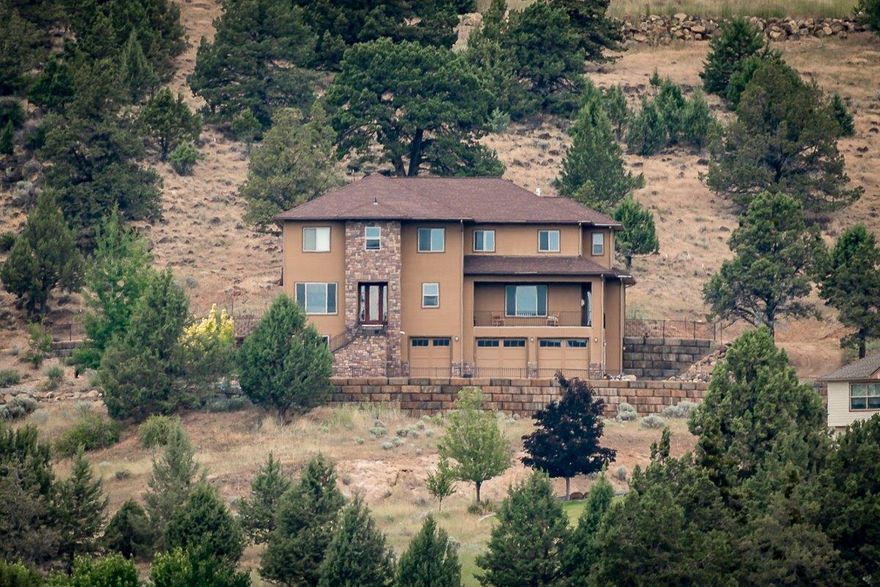 2006 Custom Home on 2.43 acres with a breathtaking View of the neighboring hills & the Lost River Valley! Private end-of-road location. This Home features Main-level, Open Concept Living with High Ceilings that allow for stunning 180 degree Views. Surround Sound is throughout. The Chef's Kitchen features a large Island for food prep, Gas Cooktop, dual Wall Ovens, & all of the modern amenities. Throughout the home is exquisite custom Cherry Wood cabinetry. 3 bedrooms & 2 full baths are on the Upper level with 9' ceilings. The Master Suite is expansive with a pass-through Gas Fireplace and attached Bath; Steam Shower, Jetted Tub, His & Her's sinks, and a walk-in, fully organized Dressing Room. The wide Stairwell leads to the Lower level 4th Bedroom/Studio that has it's own private entry, complete with a Kitchenette and Full Bath. The 3 car oversized Garage completes this amazing and distinctively appointed Home. Make your appointment today