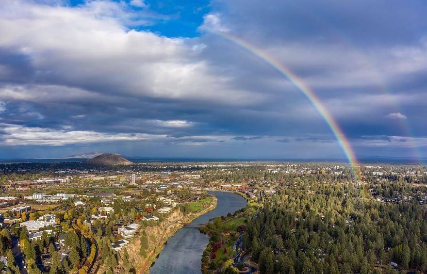 Welcome to this ovely Woodriver Village property. This unique neighborhood offers abundant nature, wildlife AND all the urban conveniences. Flat buildable land surrounded by mature trees and custom homes. Plenty of room to build on this property and be just down the road from the Deschutes River trail. Within walking distance to the river, the Old Mill, the Amphitheater, dining, shopping and of course coffee. Buyer to do due diligence on development potential, Utilities at the street.