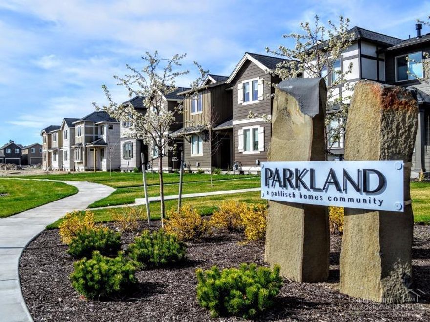 Located in SW Redmond lies this beautiful new, 1,450 sq.ft. Parkland townhome by award-winning Pahlisch Homes. With quartz countertops in the kitchen & baths, under-mount sinks, laminate wood flooring & a gas fireplace, it is evident that quality finishes are used throughout. This home features 3 beds, 2.5 baths & a 2 car garage. Photos of similar unit-specs vary. Floor Plan: Parkland 2-F-1450-2 (middle unit). See for yourself why Pahlisch has won 150+ quality and value awards: Model Open Thurs-Sun 12-3.