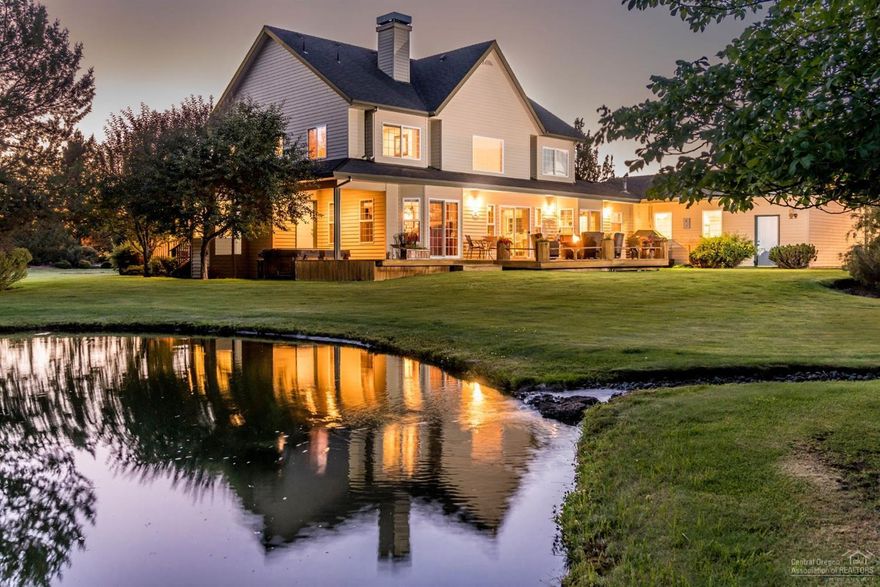 Incredible privacy on estate-sized 20 acre parcel. 5 bedroom, 4 bath features wrap-around covered porch. Wonderful floor plan includes main-level master suite. HUGE SHOP (spacious guest quarters above) perfect for RV, toys, cars! Quality craftsmanship throughout: hardwood-stone-built-in's. Auto-sprinkled, extensive landscaping, pond, and waterfall provide stunning outdoor living areas; riding trails are invisible beyond the yard. Close to schools, medical, next to upscale neighborhood, with paved drive